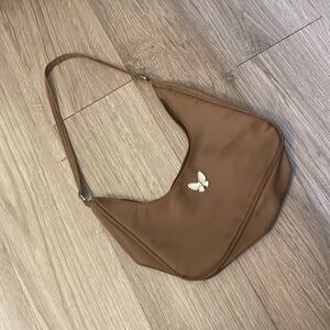 A brown shoulder bag , hardly worn from shein.com